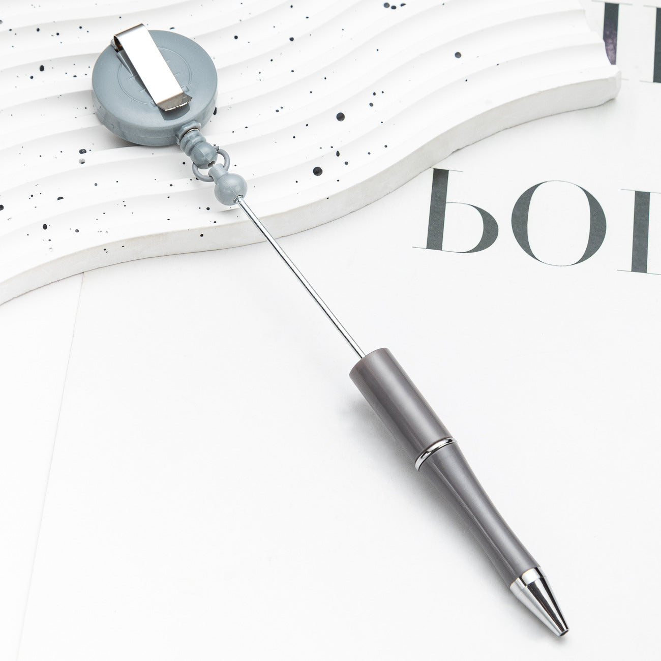 Easy-pull button bead pen