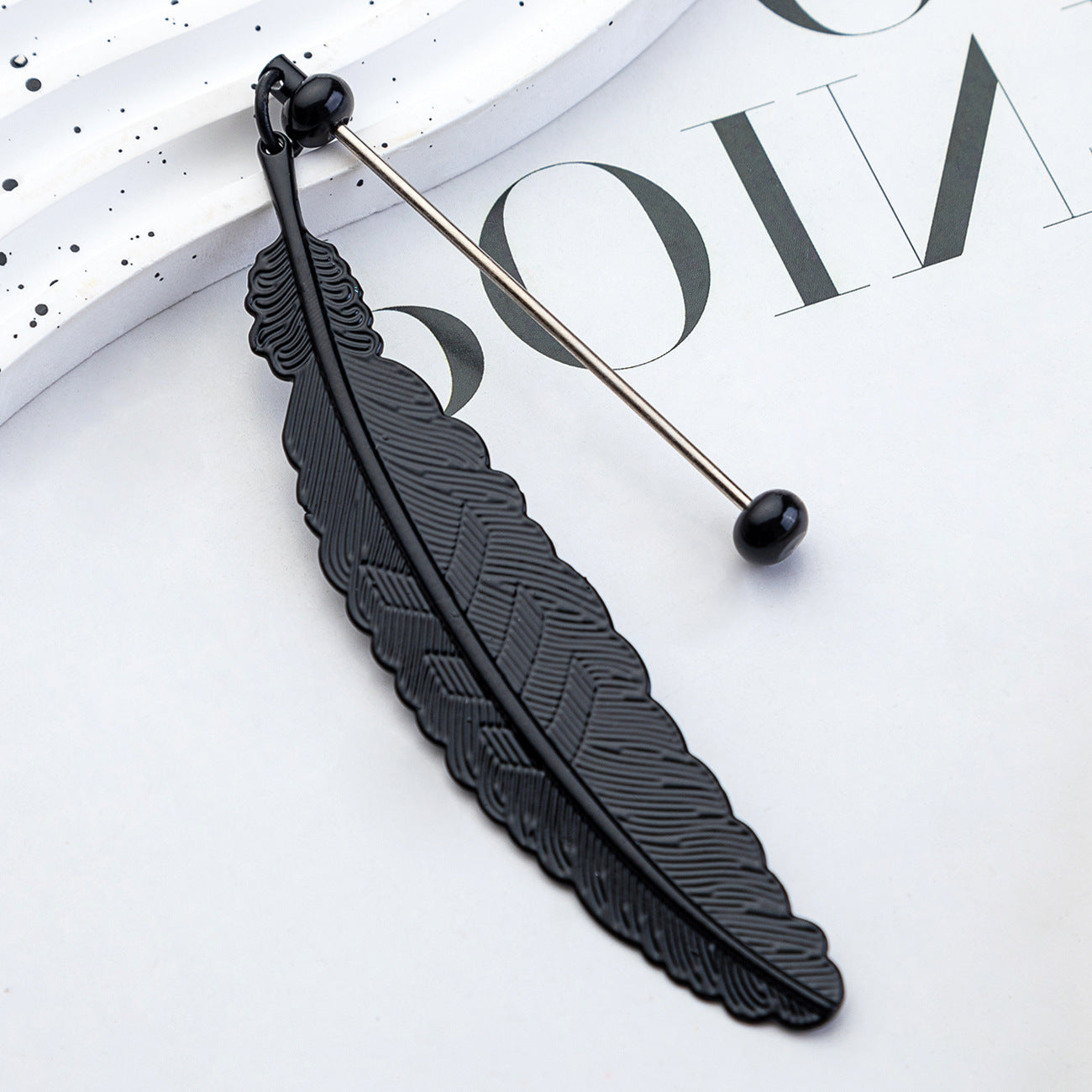DIY beaded feather bookmark