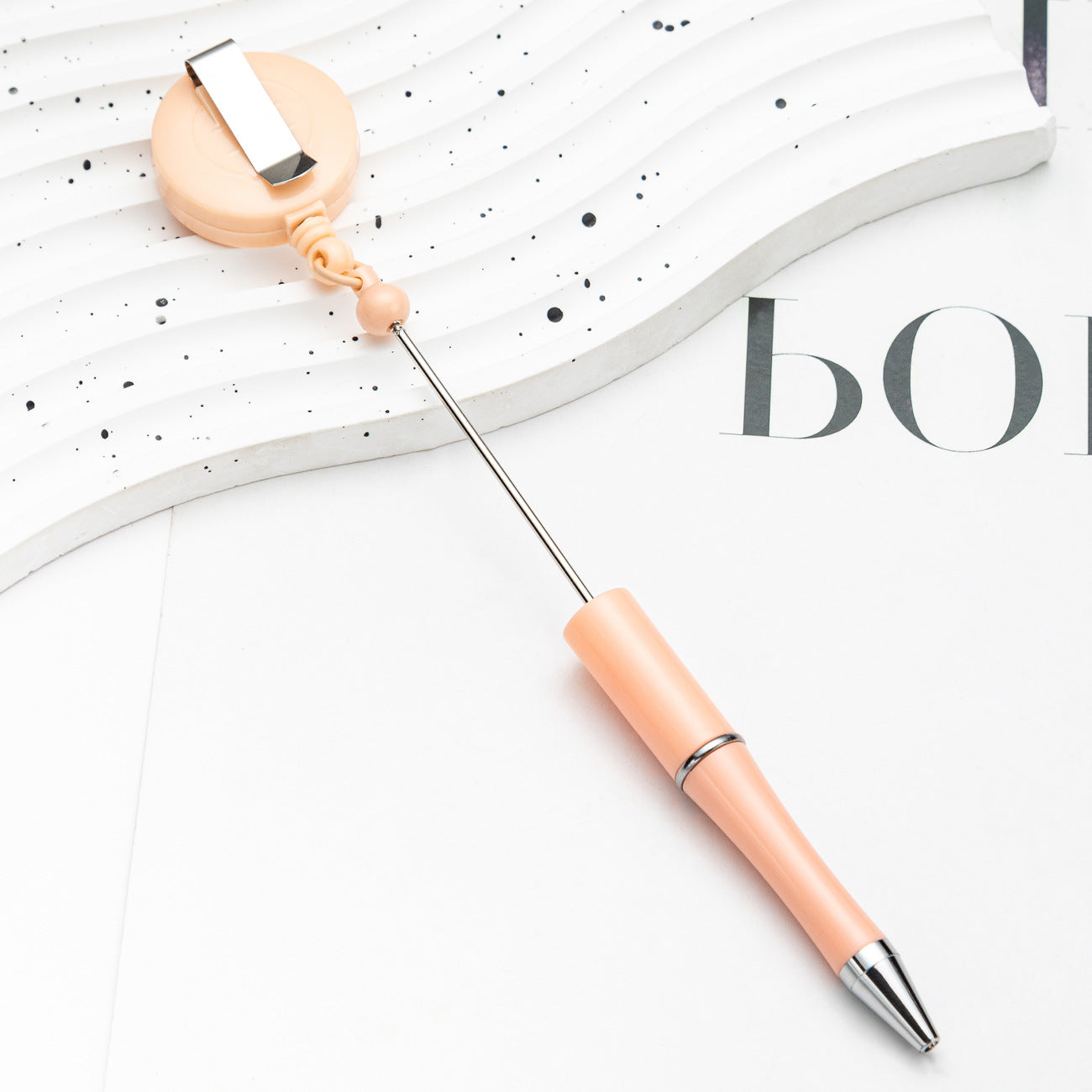 Easy-pull button bead pen