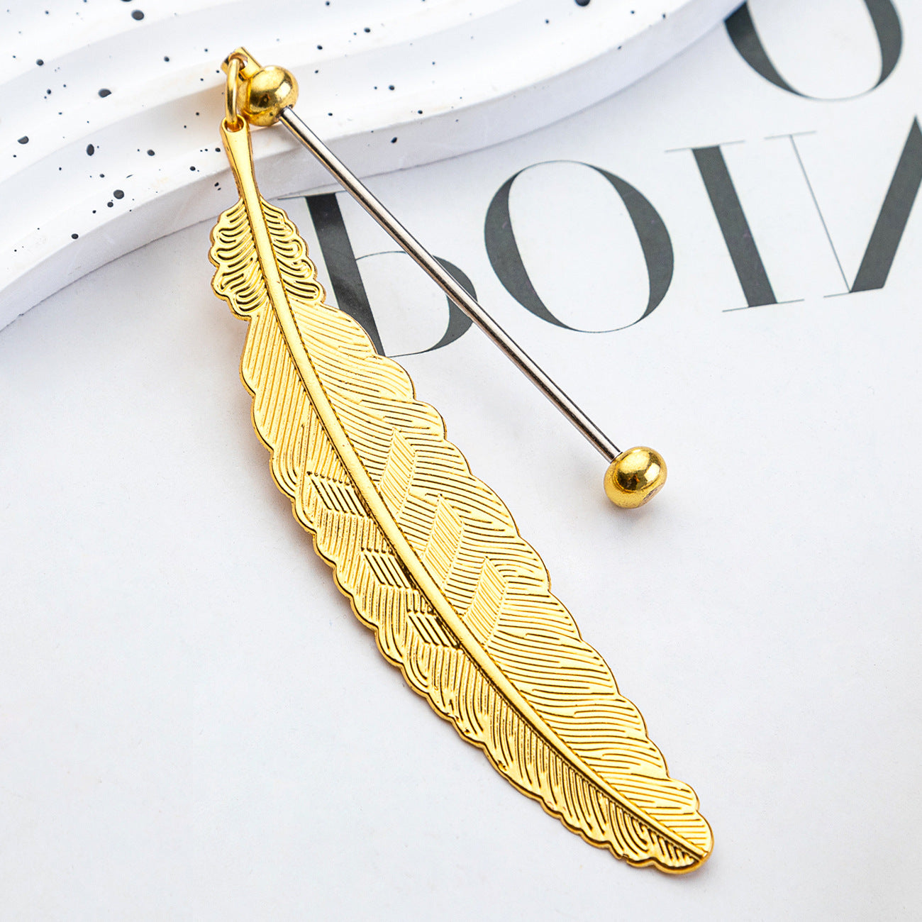 DIY beaded feather bookmark