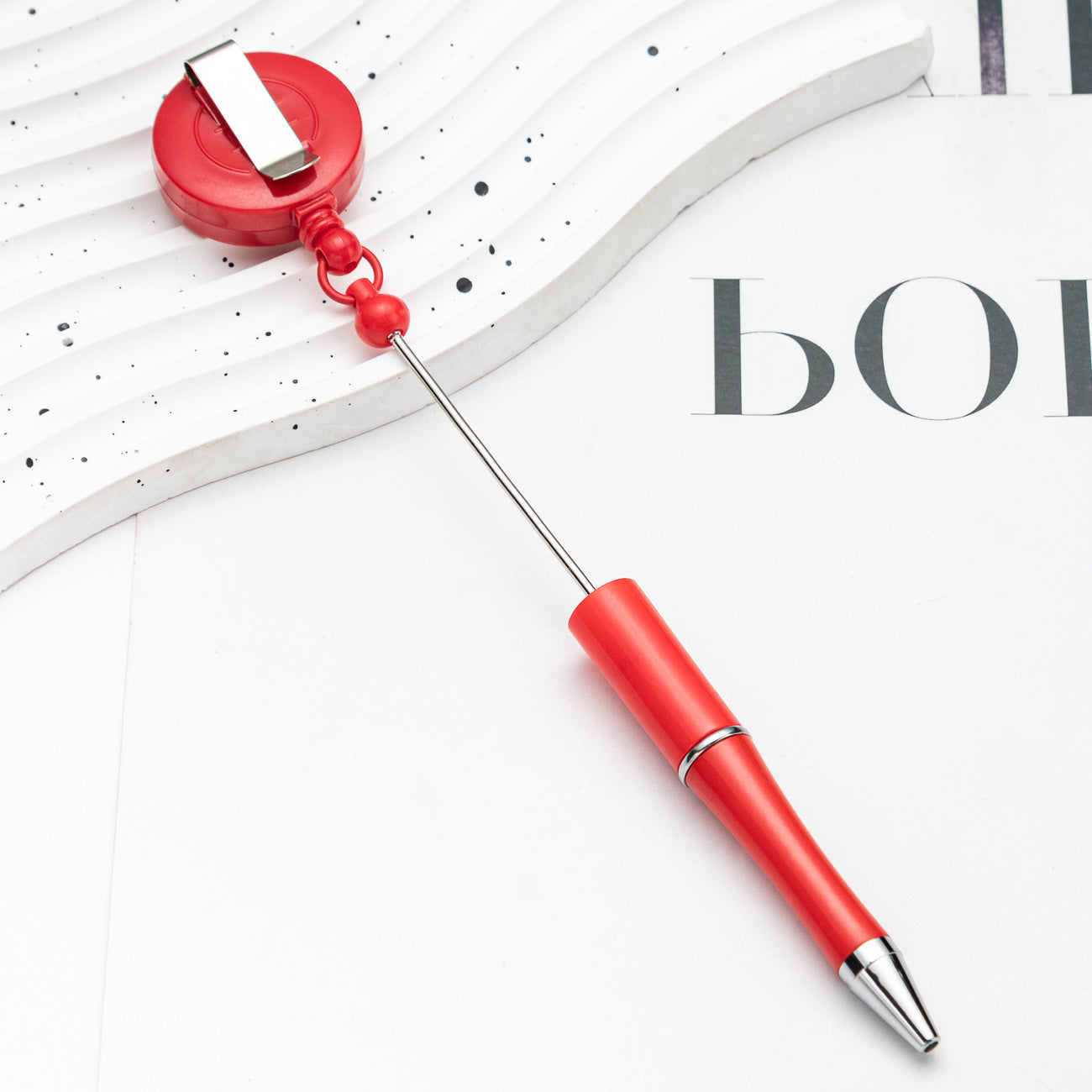 Easy-pull button bead pen