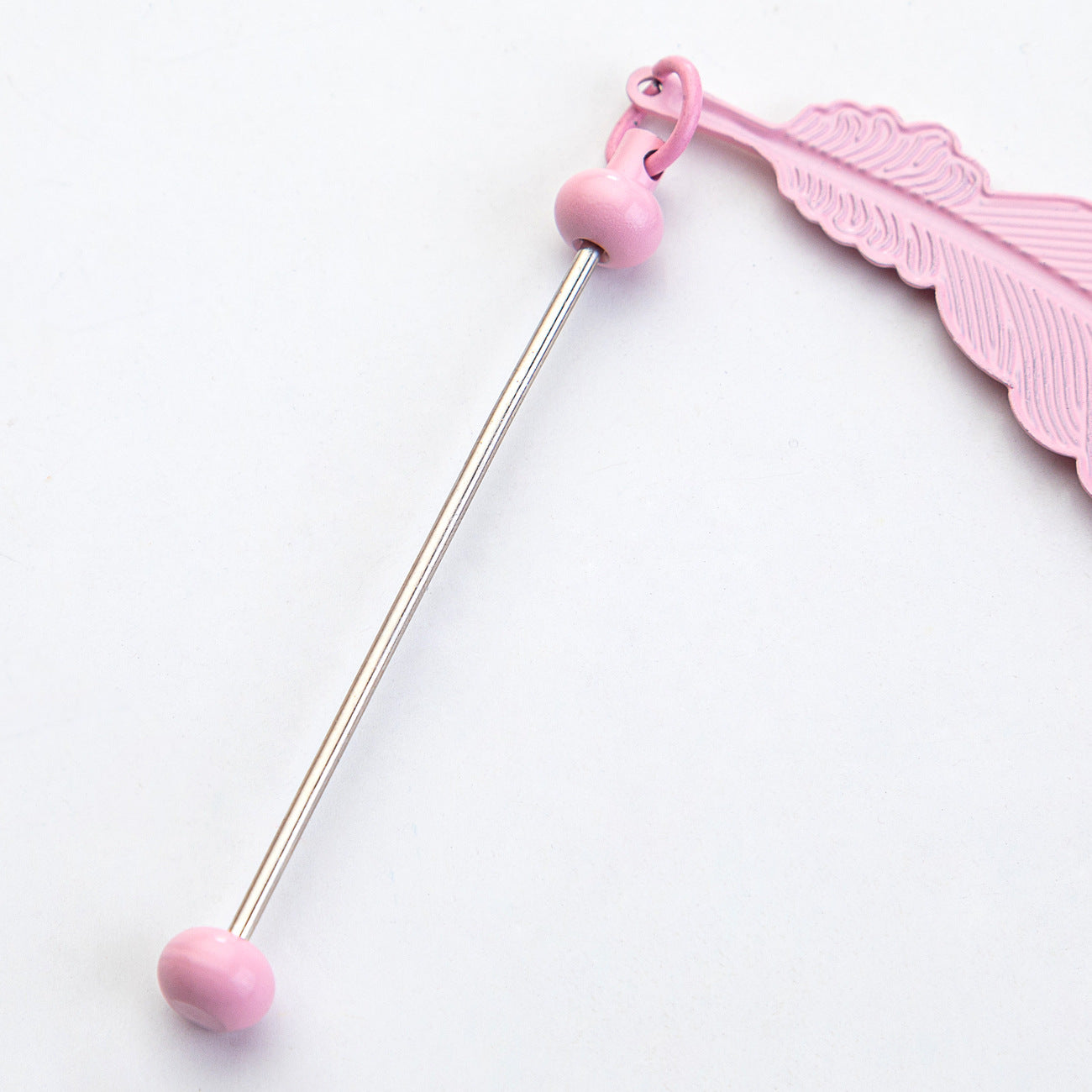DIY beaded feather bookmark