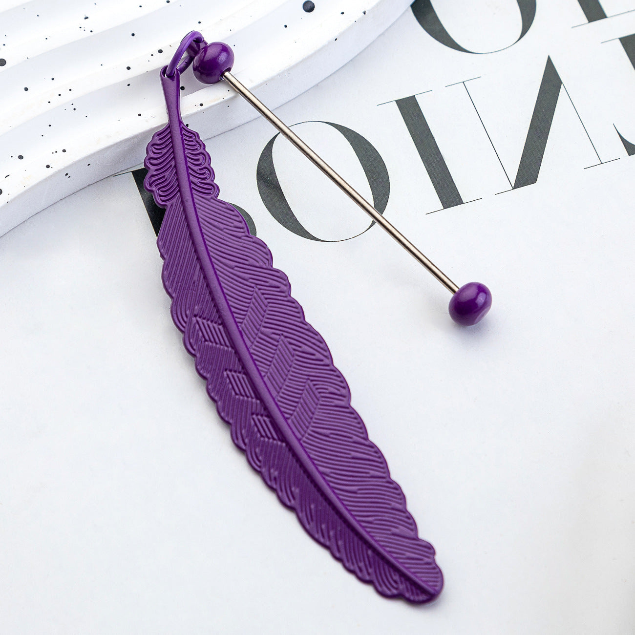 DIY beaded feather bookmark