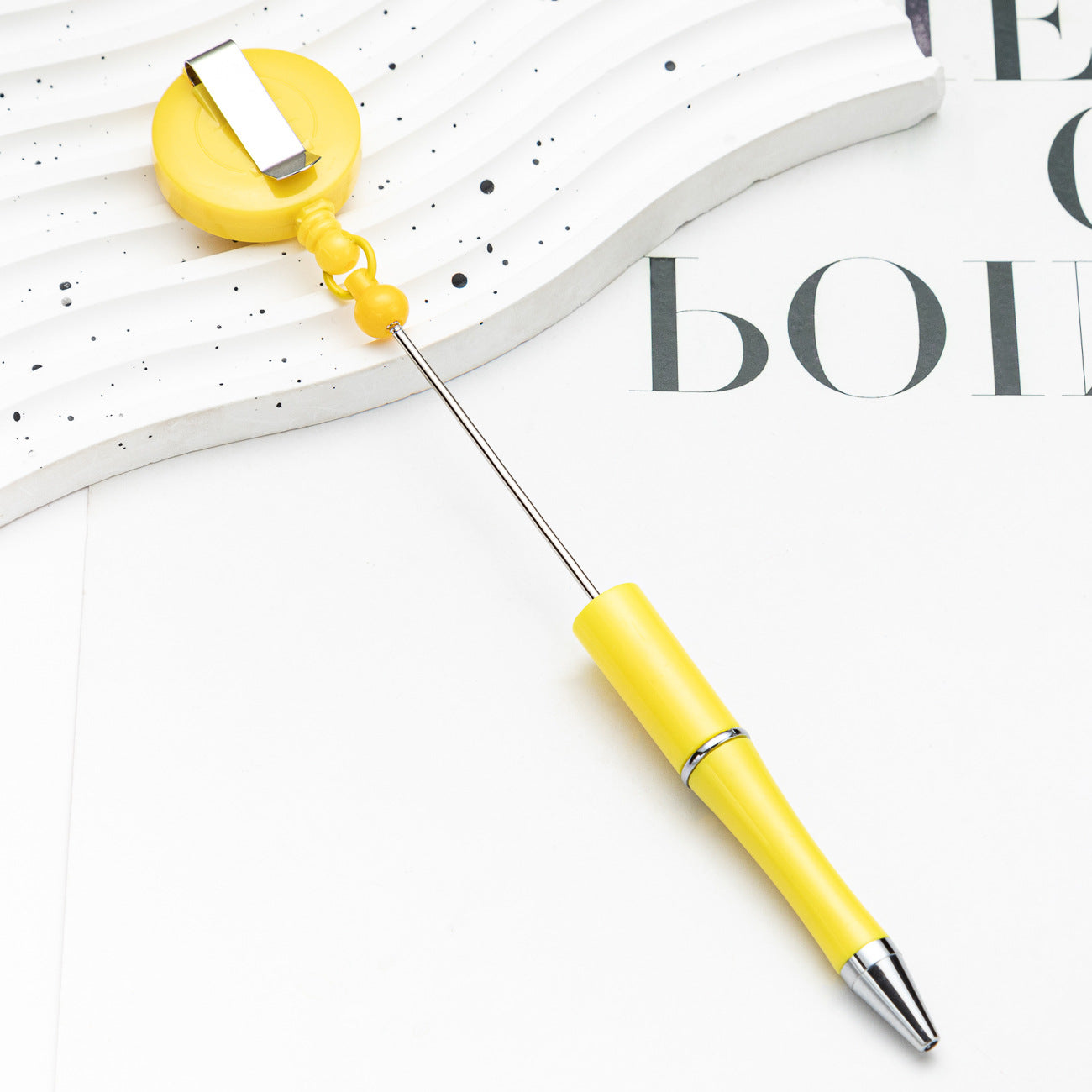 Easy-pull button bead pen
