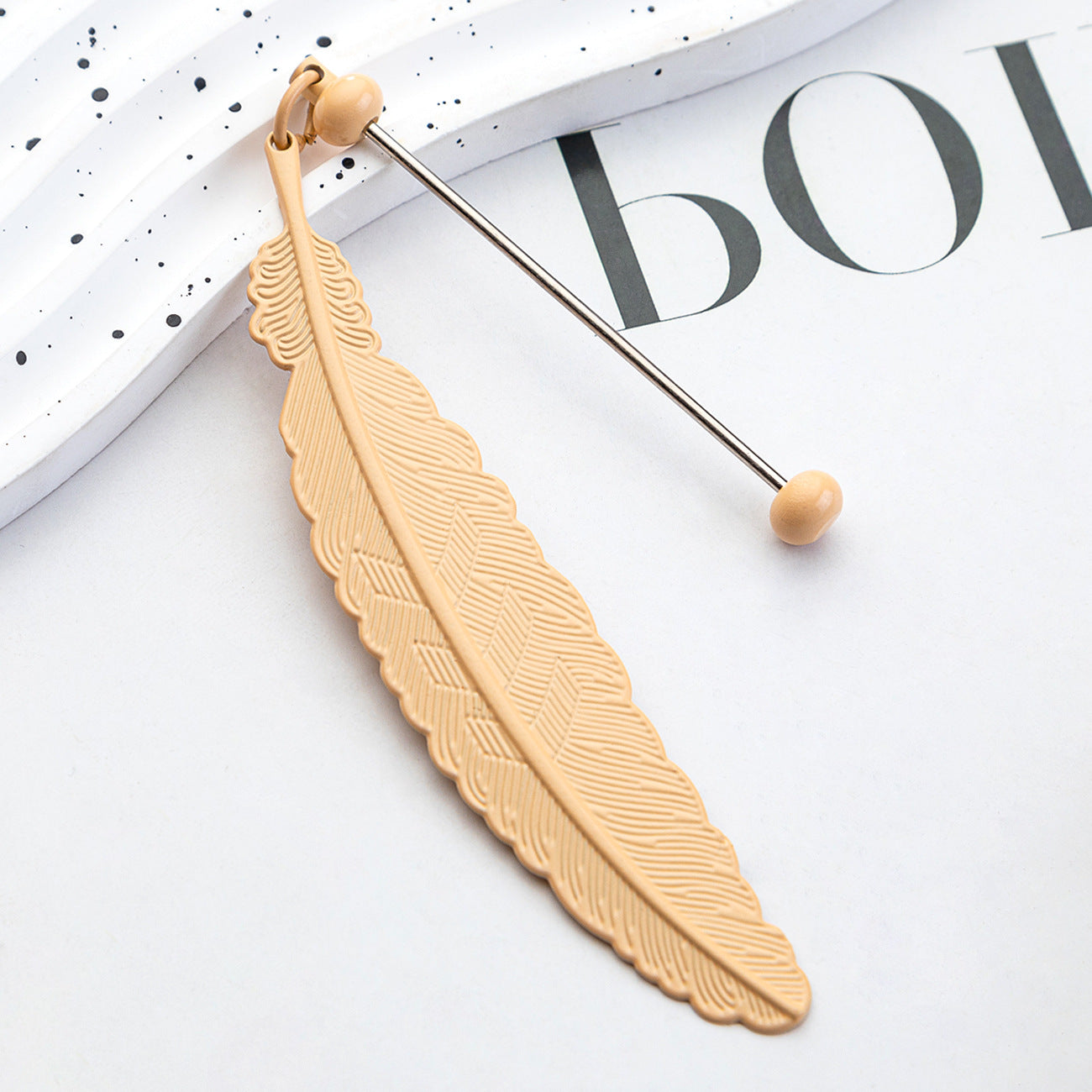 DIY beaded feather bookmark