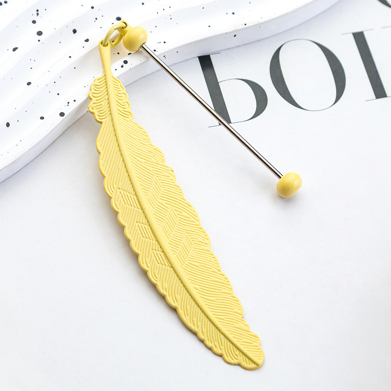 DIY beaded feather bookmark