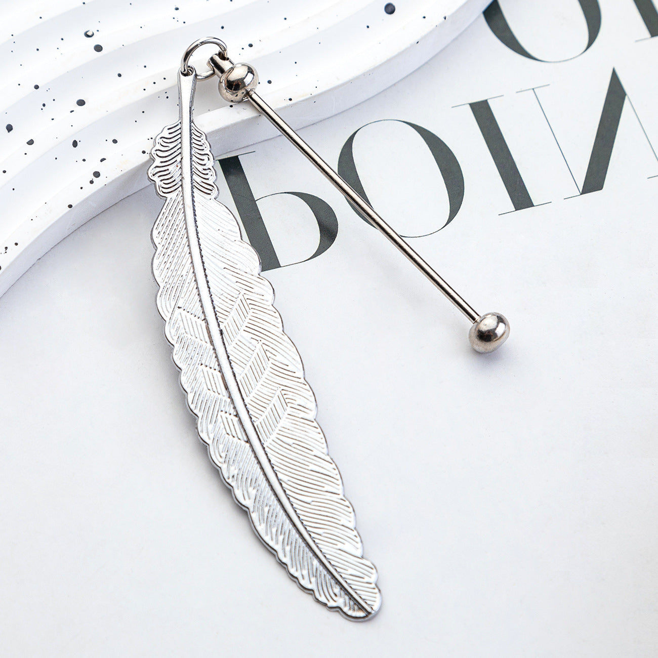 DIY beaded feather bookmark