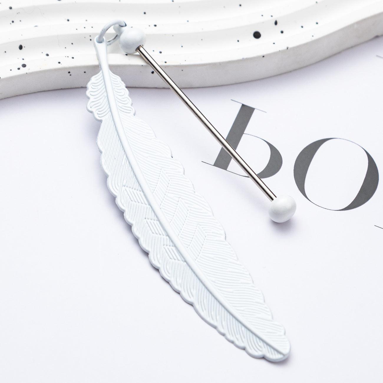 DIY beaded feather bookmark
