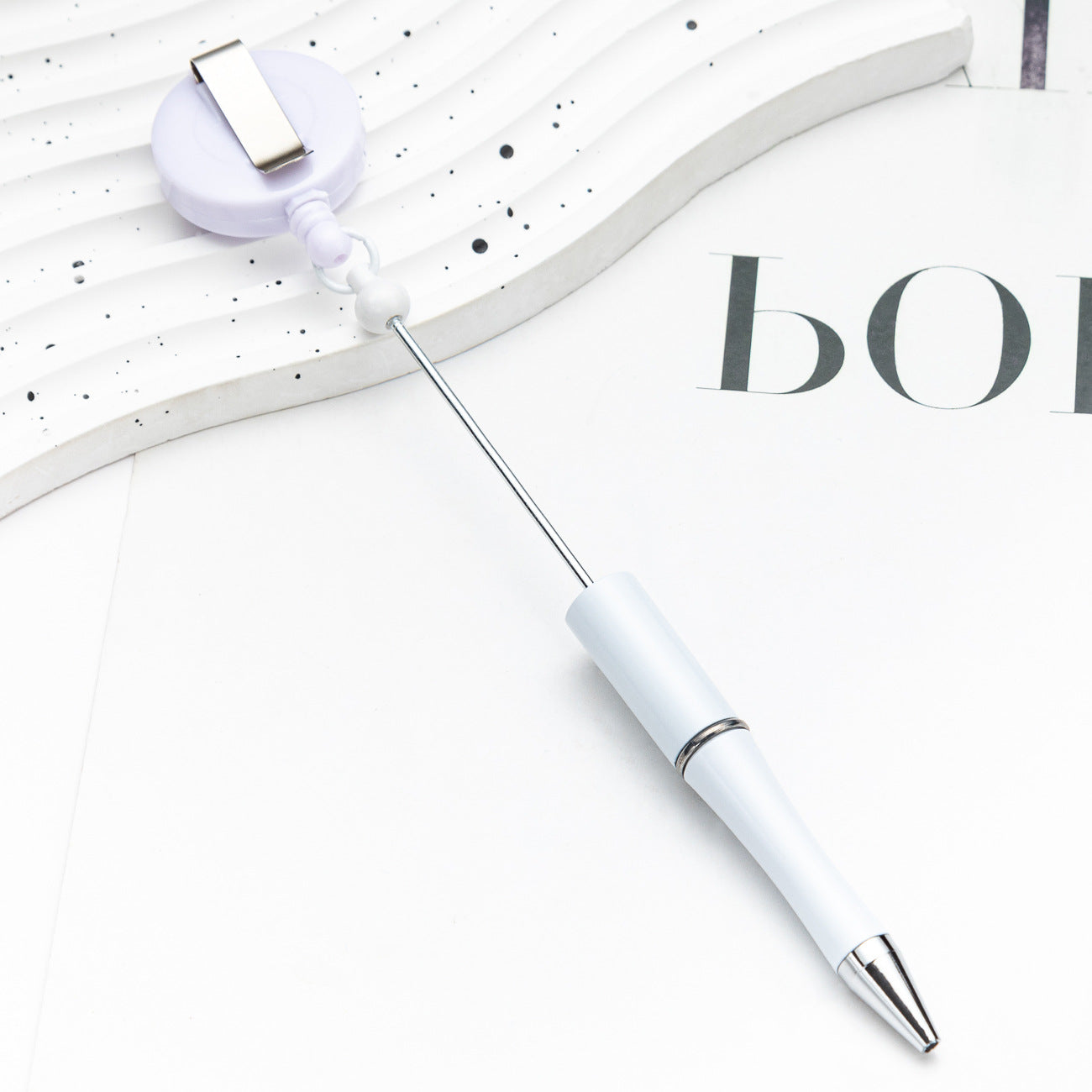 Easy-pull button bead pen
