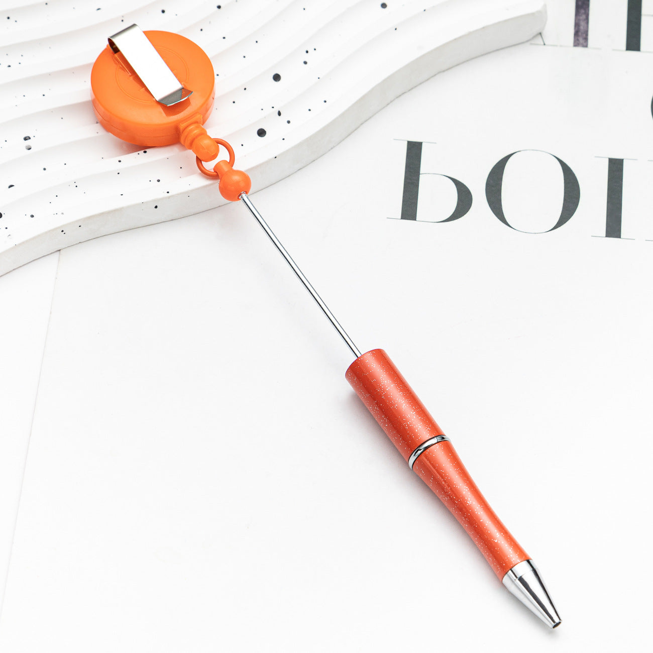 Easy-pull button bead pen