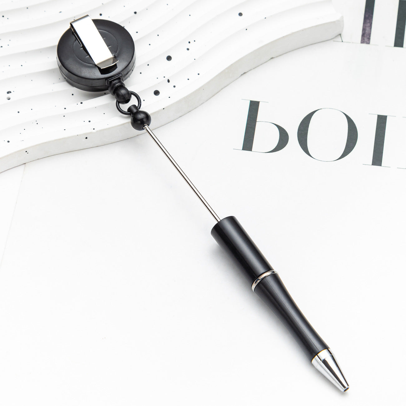 Easy-pull button bead pen
